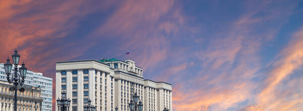 Building of The State Duma of the Federal Assembly of Russian Federation on a beautiful sky with cloud before sunset background, Moscow, Russia   