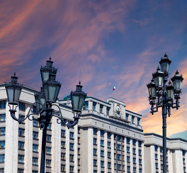 Building of The State Duma of the Federal Assembly of Russian Federation on a beautiful sky with cloud before sunset background, Moscow, Russia