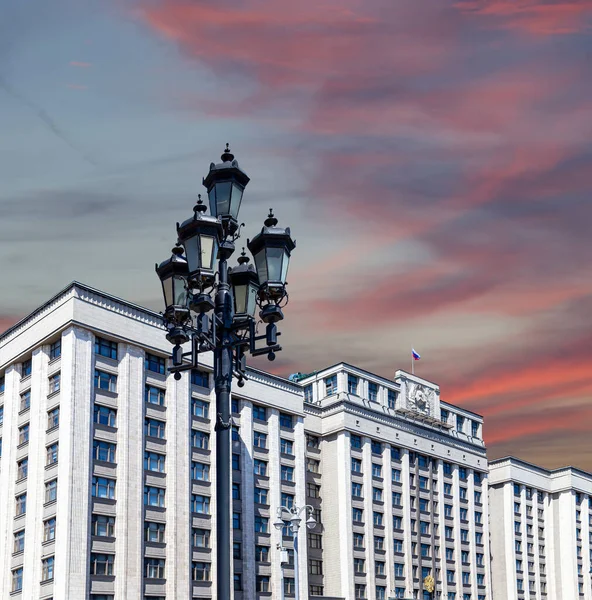 Building of The State Duma of the Federal Assembly of Russian Federation on a beautiful sky with cloud before sunset background, Moscow, Russia