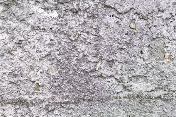 Taş duvar dokusunun arka planı, yıpranmış duvar