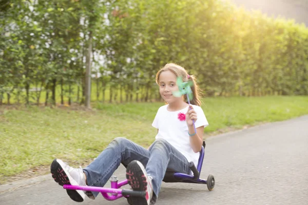 Happy Little Girl Driving Her Toy Park — Stock Photo, Image