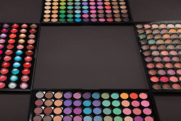 Colorful makeup eyeshadow palettes as background — Stock Photo, Image