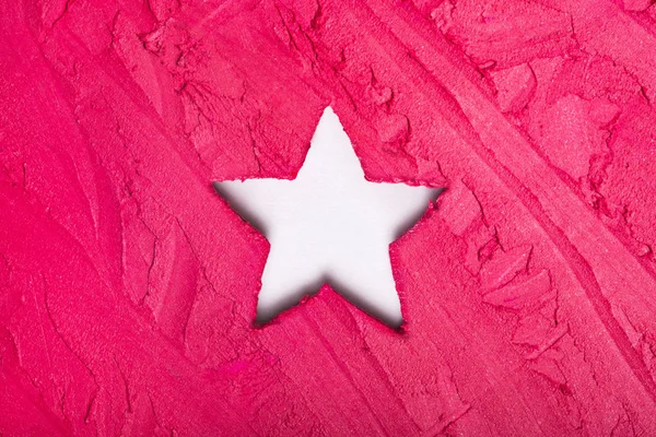 Fond de rouge à lèvres tacheté avec un trou en forme d'étoile blanche — Photo