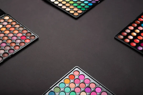 Make-up colorful eyeshadow palettes as a make-up background — Stock Photo, Image