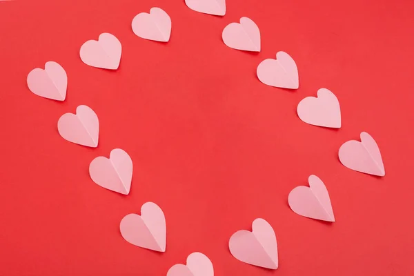Paper hearts frame on red background — Stock Photo, Image