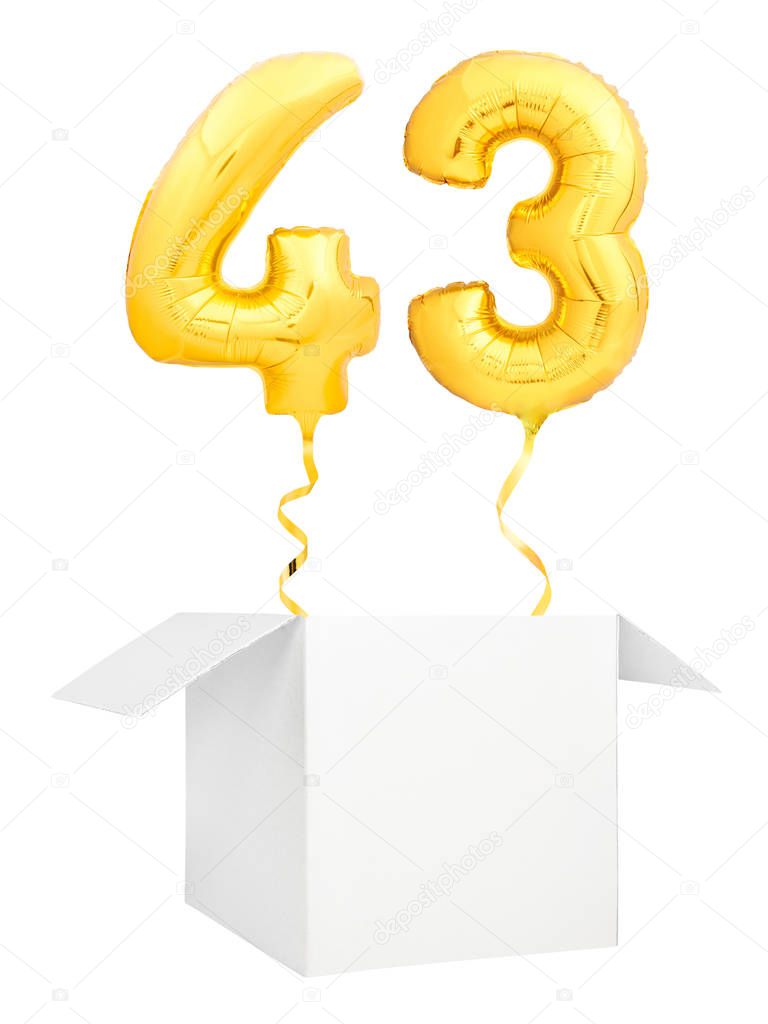 Golden number forty three inflatable balloon with golden ribbon flying out of blank white box isolated on white background