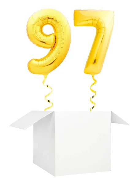 Golden number ninety seven inflatable balloon with golden ribbon flying out of blank white box isolated on white background — Stock Photo, Image