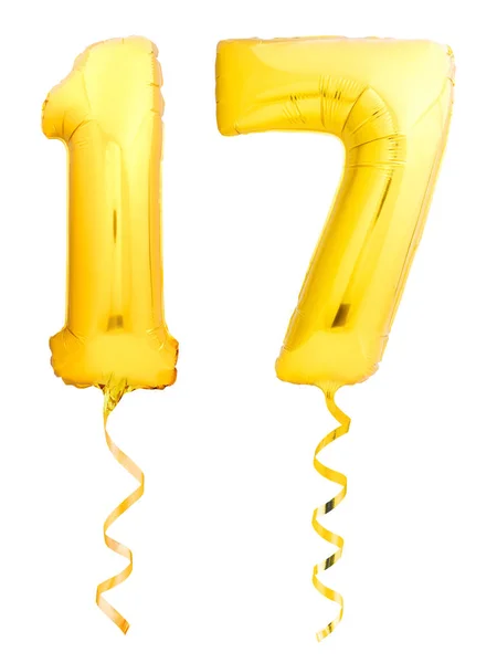 Zlaté číslo 17 sedmnáct vyrobené z Nafukovací balónek s mašlí izolované na bílém — Stock fotografie