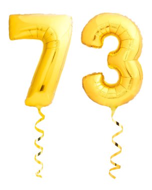 Beyaz kurdele ile şişme balon yapılmış altın sayı seventythree 73