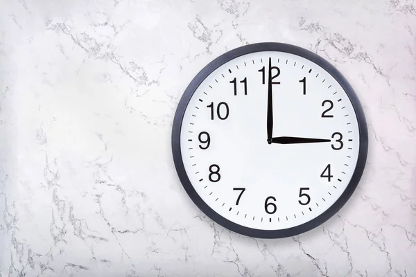 Wall clock show three oclock on white marble texture. Office clock show 3pm or 3am — Stock Photo, Image