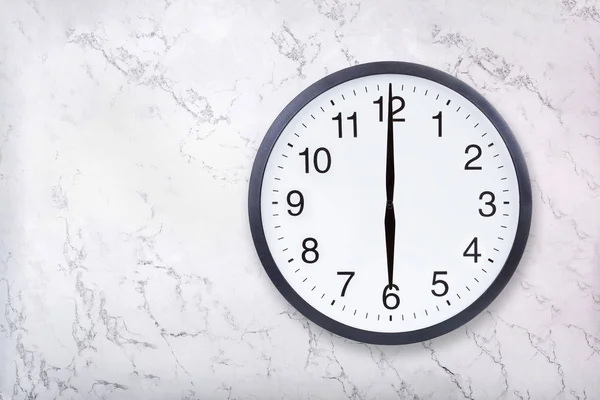 Wall clock show six oclock on white marble texture. Office clock show 6pm or 6am — Stock Photo, Image