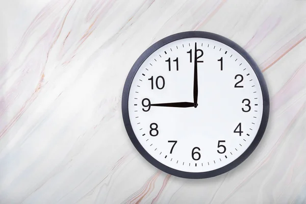 Wall clock show nine oclock on marble texture. Office clock show 9pm or 9am — Stock Photo, Image