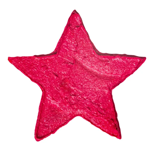 Образец красной помады в виде звезды, выделенной на белом фоне — стоковое фото