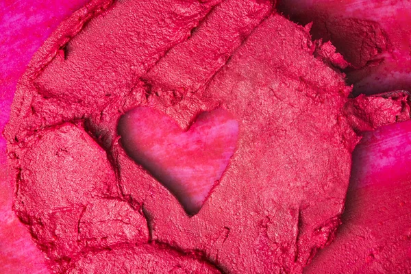 Červená rtěnka textura s tvaru srdce. Koncept krásy — Stock fotografie