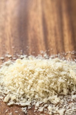 Panko Japanese flaky bread crumbs on wooden plate, photographed with natural light (Selective Focus, Focus one third into the image)  clipart