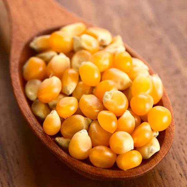 Yellow Raw Popcorn Kernels Wooden Spoon Photographed Natural Light Selective — Stock Photo, Image