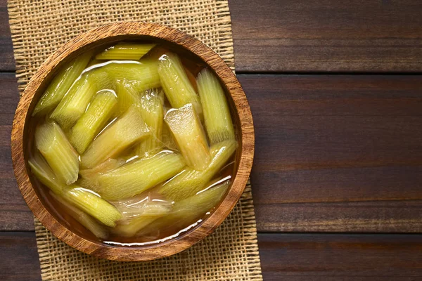 Fresh Homemade Rhubarb Compote Wooden Bowl Photographed Overhead Dark Wood — Stock Photo, Image