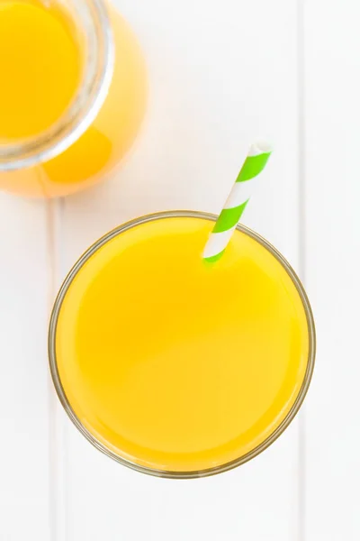 Orange Juice Glass Drinking Straw Photographed Overhead White Wood Selective — Stock Photo, Image