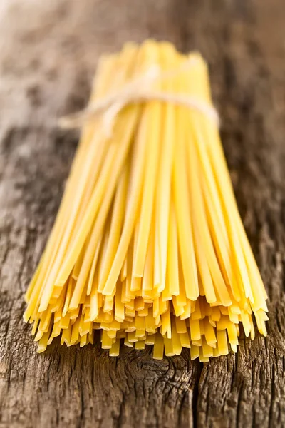 Raw Flat Long Ribbon Pasta Called Fettuccini Tied Bundle Rustic — Stock Photo, Image