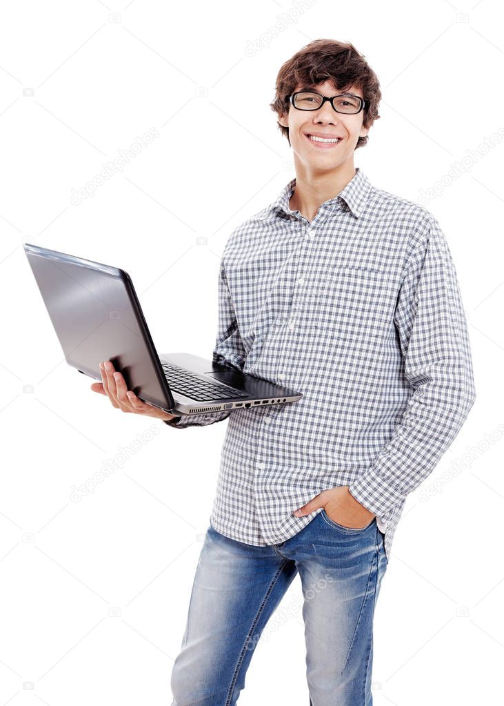 Young hispanic man wearing checkered shirt, blue jeans and black glasses holding open laptop in his hand and smiling isolated on white background - information technology concept