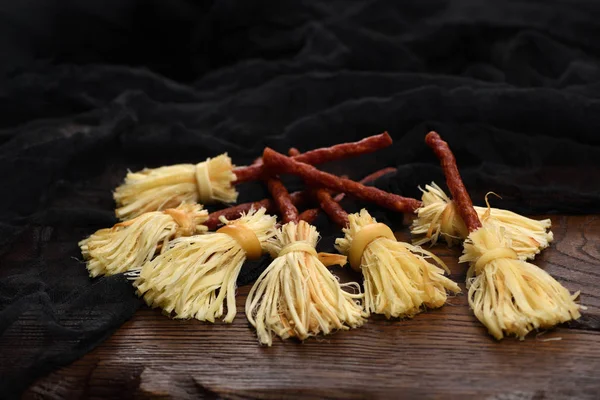 Witches Broom of smoked cheese suluguni and salami — Stock Photo, Image