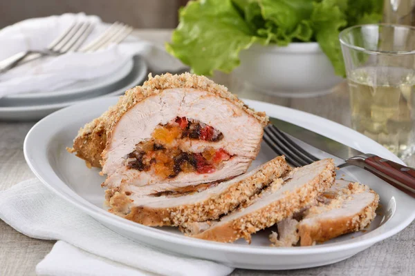 turkey breast stuffed with dried prunes, dried apricots and cherries in breadcrumbs and parmesan breading