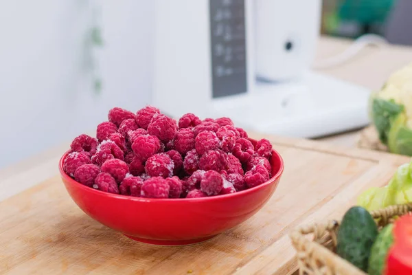 Frozen fresh raspberries on a plate. — Stock Photo, Image