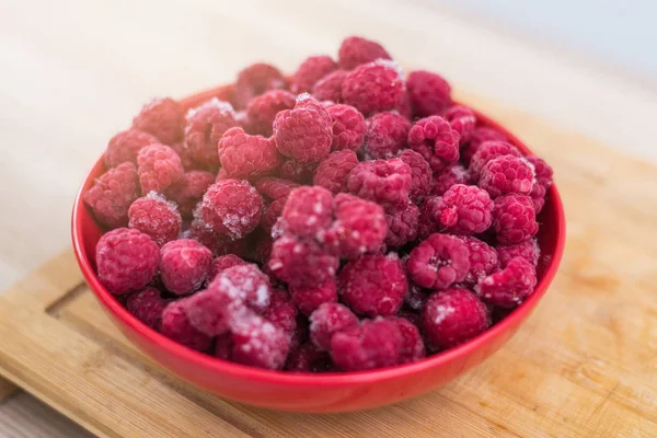 Frozen fresh raspberries on a plate. — Stock Photo, Image
