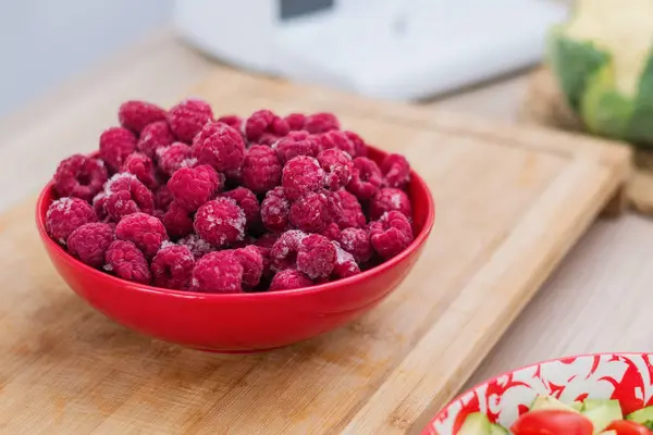 Frozen fresh raspberries on a plate. — Stock Photo, Image