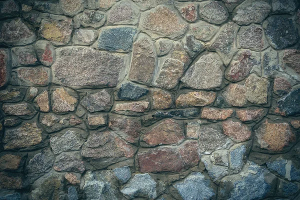De muur van natuursteen. Textuur van massief stenen. — Stockfoto