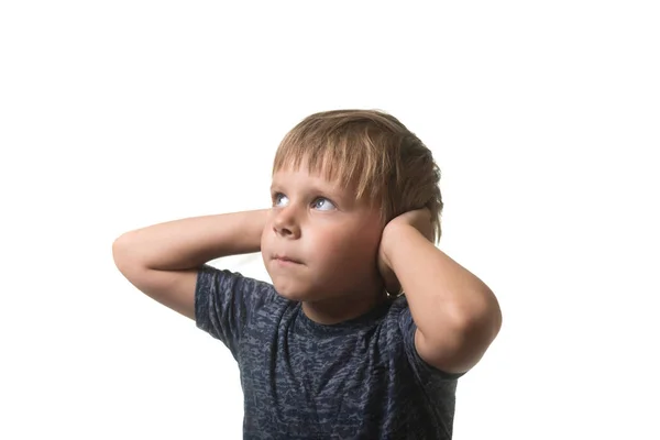 Little boy covered his ears with his hands isolated on white background. Stock Photo