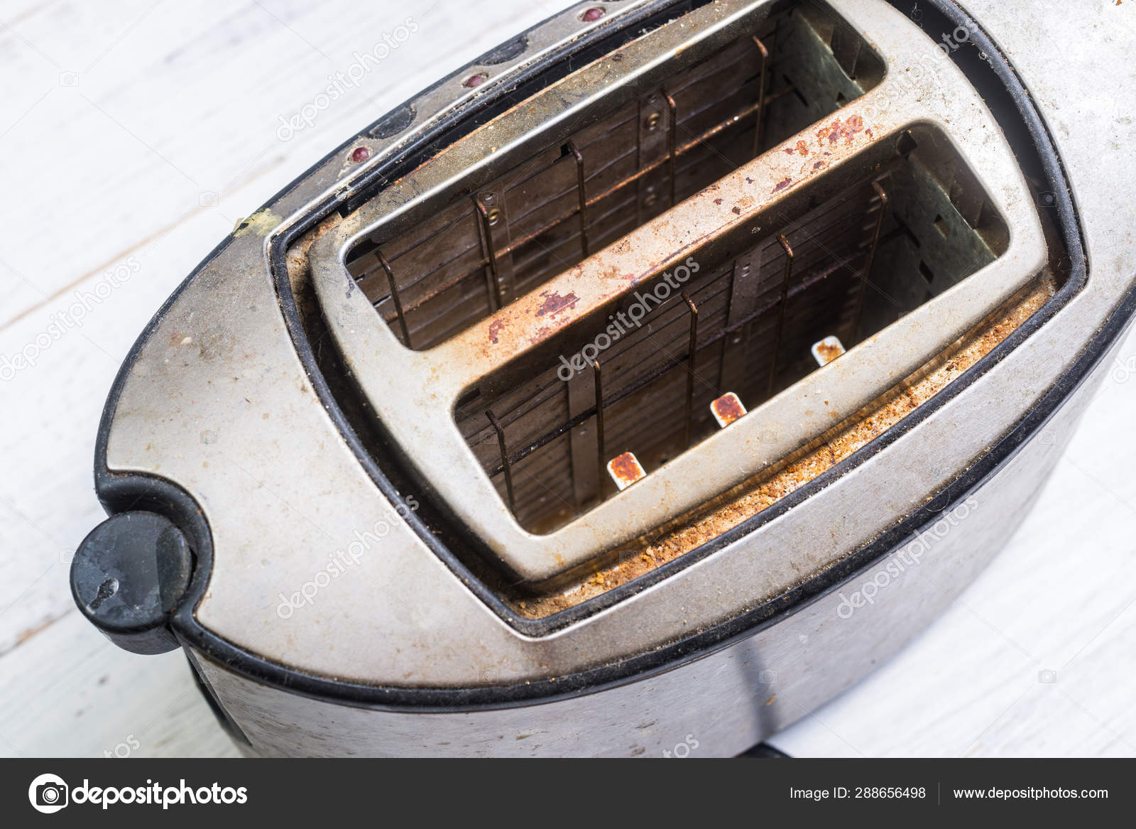 Dirty old toaster on white wooden Broken kitchen