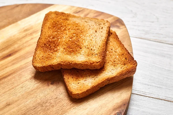 Ahşap Bir Zeminde Kızarmış Ekmek Tostları — Stok fotoğraf