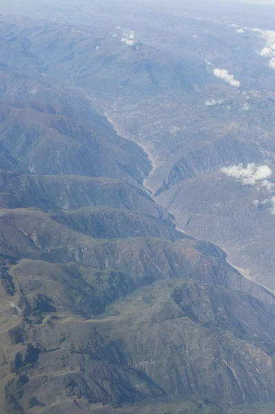 Aerial view of dry desert and the Andes Mountains somewhere over South America