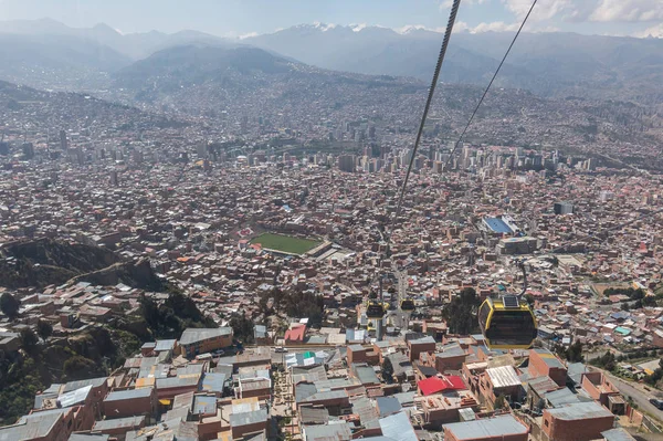 BOLIVIA, LA PAZ, 7 JUNE 2015 - Mi Teleferico is an aerial cable car urban transit system in the city of La Paz, Bolivia. In the background, the royal mountain range.