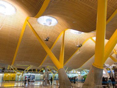 Madrid, Spain - January 27, 2018: Interior of Barajas Airport in Madrid, Spain. Interior of Terminal 4, designed by Antonio Lamela and Richard Rogers clipart