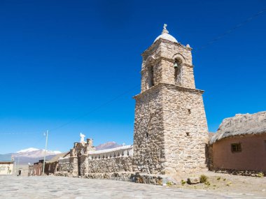 Stone church of the village of Sajama. The small Andean town of  clipart