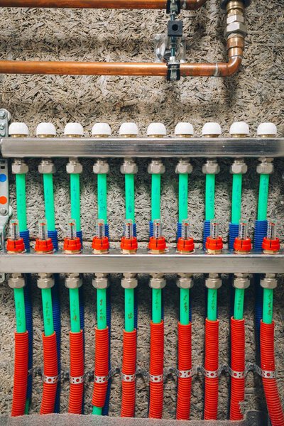 manifold collector with pipes of underfloor heating system