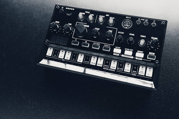 Black analog synthesizer, close-up view