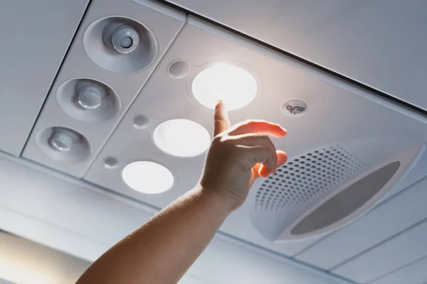 Child Hand Pointing Light Lamp Airplane Cabin — Stock Photo, Image