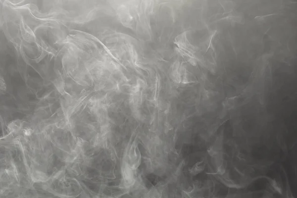 Щільний дим на чорному тлі — стокове фото