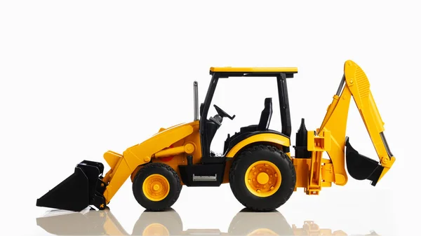 Backhoe tractor speelgoed, witte achtergrond — Stockfoto