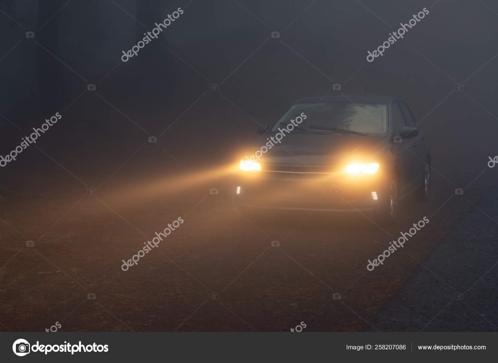Car headlight beams in dense mist Stock Photo by ©nikkytok 258207086