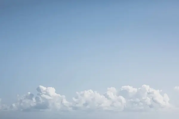 Clouds on blue sky at sunny day, minimalism nature background — Stock Photo, Image