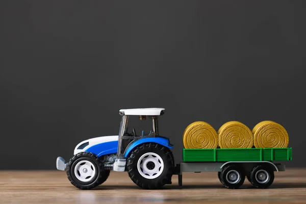 farm tractor toy with hay trailer