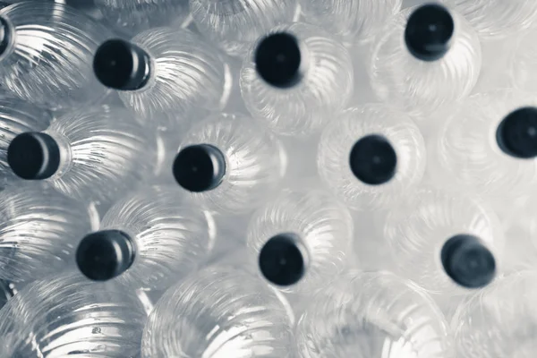 Abstract transparante plastic flessen achtergrond — Stockfoto