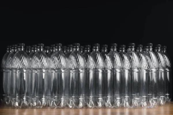 Empty plastic bottles on black background — Stock Photo, Image