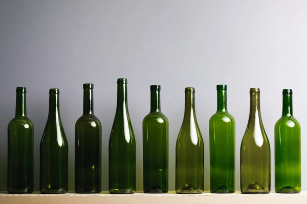 empty wine bottles, gray background