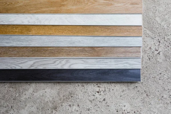 Laminate Flooring Planks Variations Concrete Floor — Stock Photo, Image