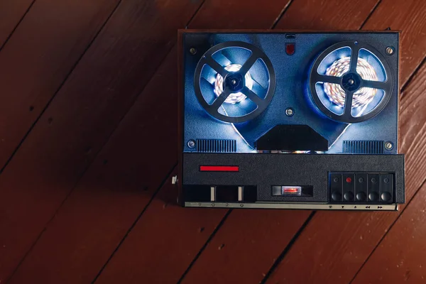 reel to reel audio tape recorder with blue led light strip. VU meter with \